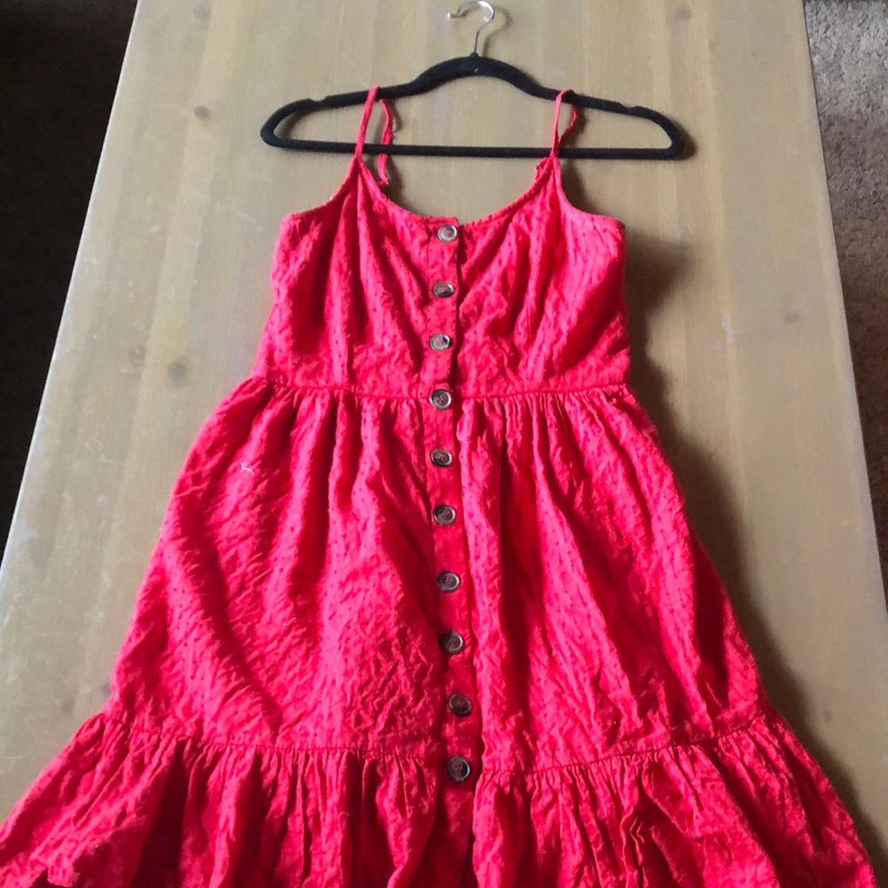 Red flirty dress button detail